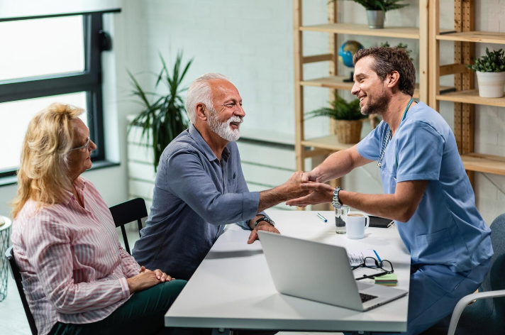 Care team providing behavioral health support to a senior patient during an in home consultation.